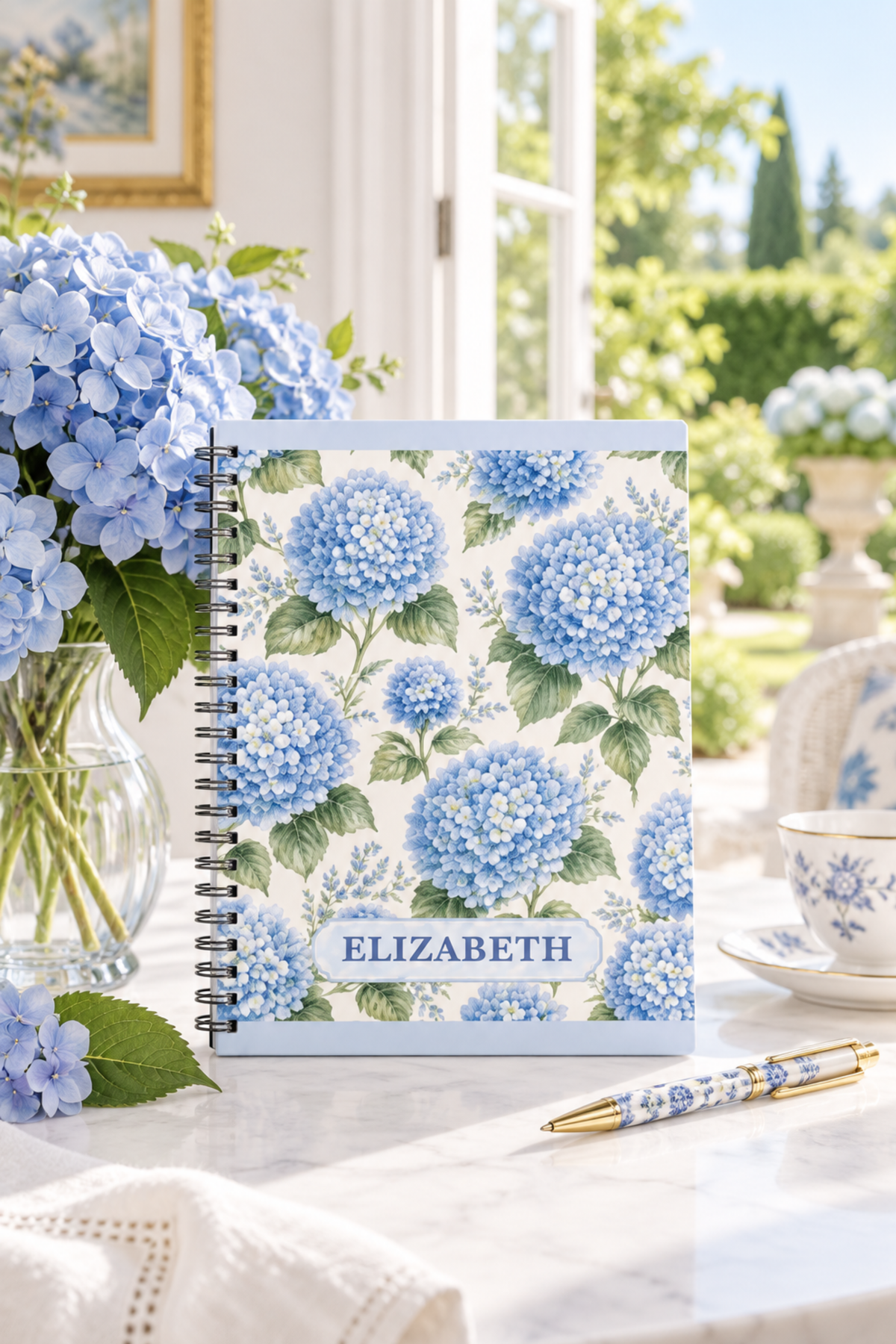 Personalised blue hydrangea notebook featuring original floral artwork by New Zealand artist Nicky Bourke